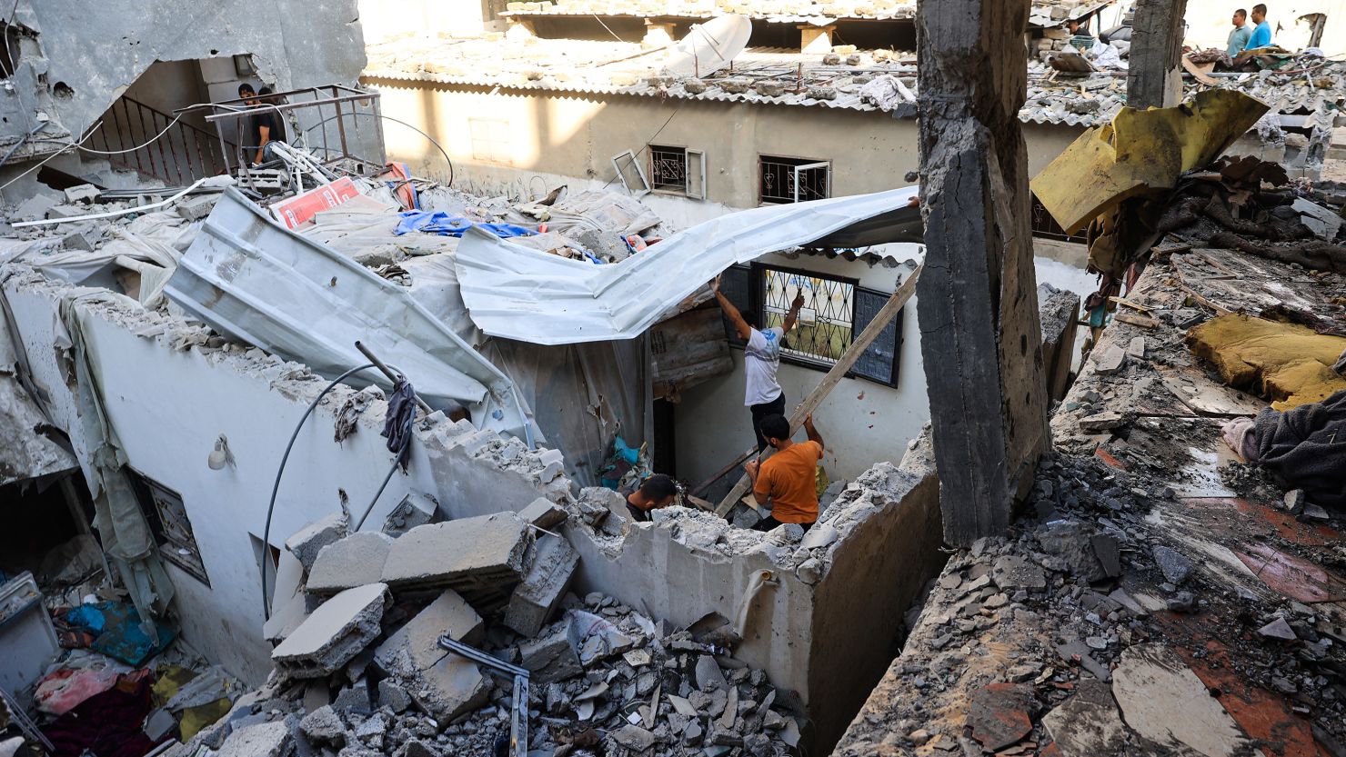 Palestinians asses the damage following an Israeli strike in the Nuseirat refugee camp in the central Gaza Strip on July 6, 2024.