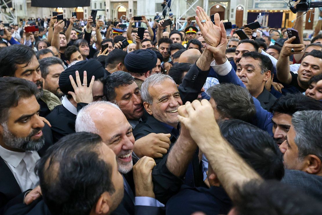 Newly-elected Iranian President Masoud Pezeshkian is cheered by supporters as he arrives at the shrine of the Islamic Republic's founder Ayatollah Ruhollah Khomeini in Tehran on July 6, 2024.