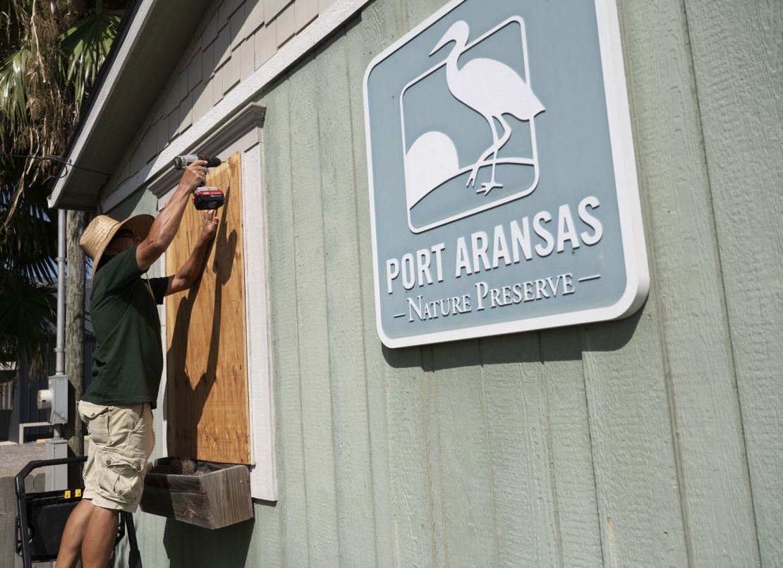 A worker boards up windows at the Port Aransas Nature Preserve office ahead of Beryl's landfall in Port Aransas, Texas, July 6, 2024.