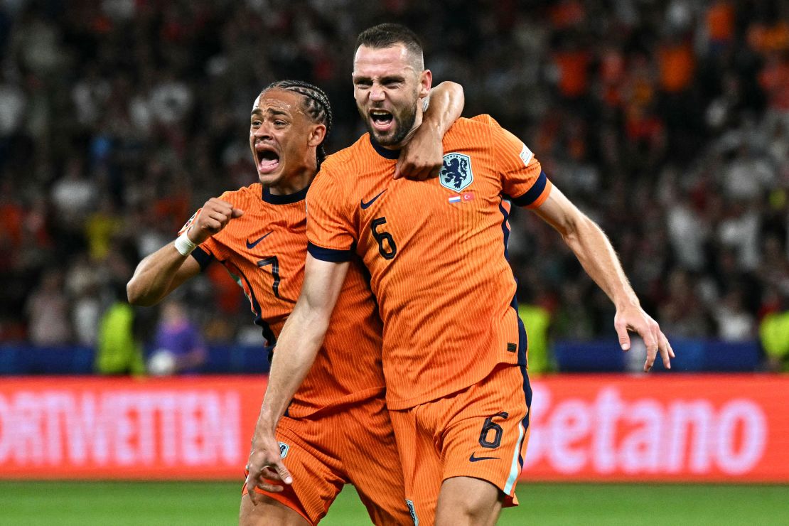 Stefan de Vrij (right) celebrates with his teammate Xavi Simons after scoring the Netherlands' first goal against Turkey.