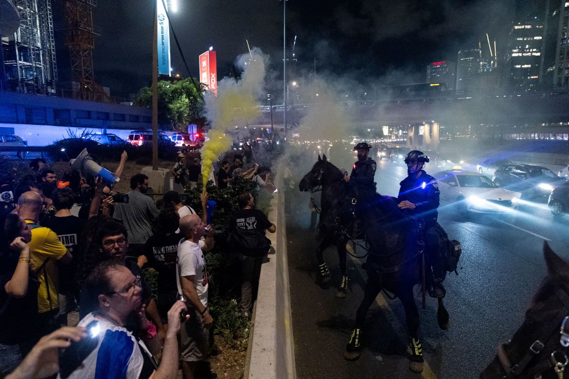 Protesters clash with mounted police officers during a demonstration calling for a hostages deal and against the Israeli Prime Minister Benjamin Netanyahu and his government on July 6, 2024 in Tel Aviv.