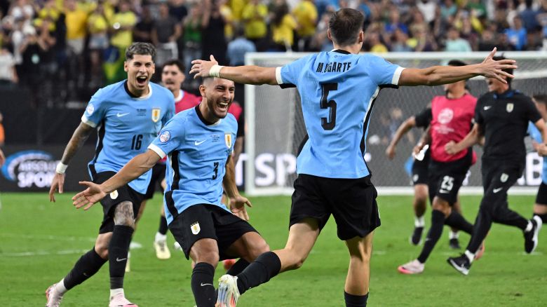 Uruguay's midfielder #05 Manuel Ugarte celebrates after scoring in a penalty shoot-out to win the Conmebol 2024 Copa America tournament quarterfinal football match between Uruguay and Brazil at Allegiant Stadium in Las Vegas, Nevada on July 6, 2024.