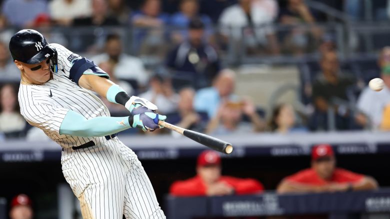 NEW YORK, NEW YORK - JULY 02: Aaron Judge #99 of the New York Yankees hits a solo home run against the Cincinnati Reds in the seventh inning at Yankee Stadium on July 02, 2024 in the Bronx borough of New York City. (Photo by Luke Hales/Getty Images)