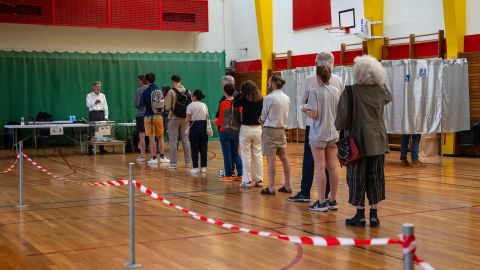 People queue to cast their vote in the second round of the parliamentary elections on July 7, 2024 in Paris, France.