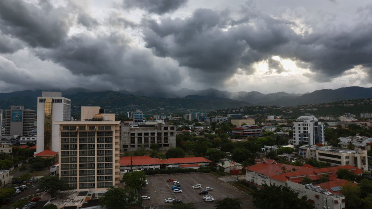 KINGSTON, JAMAICA - JULY 03: Storm clouds hover over the mountains as people make last-minute preparations for the arrival of Hurricane Beryl on July 03, 2024 in Kingston, Jamaica. Beryl has caused widespread damage in several island nations as it continues to cross the Caribbean. (Photo by Joe Raedle/Getty Images)