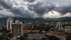 KINGSTON, JAMAICA - JULY 03: Storm clouds hover over the mountains as people make last-minute preparations for the arrival of Hurricane Beryl on July 03, 2024 in Kingston, Jamaica. Beryl has caused widespread damage in several island nations as it continues to cross the Caribbean.  (Photo by Joe Raedle/Getty Images)