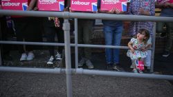 REDDITCH, UNITED KINGDOM - JULY 03: A young girl joins supporters waiting for Labour leader Sir Keir Starmer as he visits Willow Tree Community Centre on July 03, 2024 in Redditch, United Kingdom. Keir Starmer visited three countries of the UK on the final day of election campaigning. (Photo by Christopher Furlong/Getty Images)