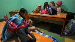 Children take shelter in the basement of the kindergarten following a missile attack in Kyiv on July 8, 2024. Russia launched more than 40 missiles at several cities across Ukraine on July 8, 2024 in an attack that killed at least 20 people people and smashed into a children's hospital in Kyiv, officials said. (Photo by Anatolii STEPANOV / AFP) (Photo by ANATOLII STEPANOV/AFP via Getty Images)