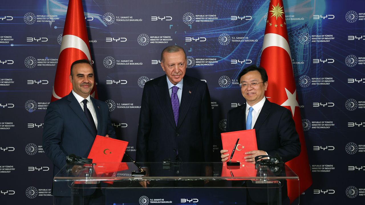 ISTANBUL, TURKIYE - JULY 08: (----EDITORIAL USE ONLY - MANDATORY CREDIT - ' TURKISH PRESIDENCY / MUSTAFA KAMACI / HANDOUT' - NO MARKETING NO ADVERTISING CAMPAIGNS - DISTRIBUTED AS A SERVICE TO CLIENTS----) Turkish President Recep Tayyip Erdogan (C), Wang Chuanfu (R), chairman and chief executive officer at BYD Co., and Turkish Minister of Industry and Technology Mehmet Fatih Kacir (L) attend the BYD New Energy Vehicle Investment Signing Ceremony after their meeting at Dolmabahce Palace working office in Istanbul, Turkiye on July 08, 2024. World's largest electric vehicle producer Chinese BYD expected to build 150,000-vehicle capacity production plant, mobility and R&D center with investment worth $1B in Turkiye, according to ministry. (Photo by Turkish Presidency/ Mustafa Kamaci / Handout/Anadolu via Getty Images)