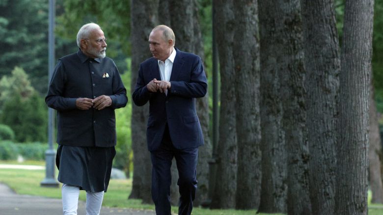 In this pool photograph distributed by the Russian state agency Sputnik, Russia's President Vladimir Putin and Indian Prime Minister Narendra Modi take a walk during an informal meeting at the Novo-Ogaryovo state residence, outside Moscow, on July 8, 2024. (Photo by Gavriil GRIGOROV / POOL / AFP) (Photo by GAVRIIL GRIGOROV/POOL/AFP via Getty Images)