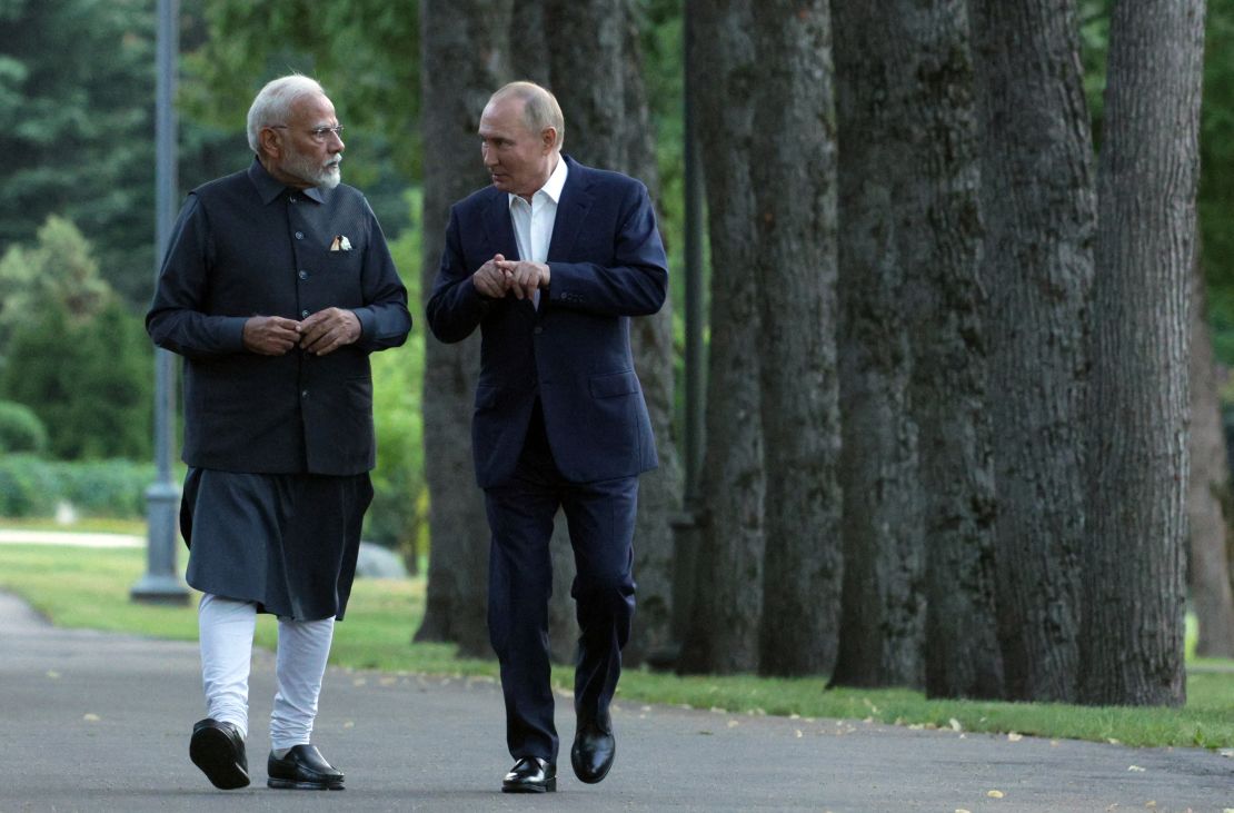 In this pool photograph distributed by the Russian state agency Sputnik, Russia's President Vladimir Putin and Indian Prime Minister Narendra Modi take a walk during an informal meeting at the Novo-Ogaryovo state residence, outside Moscow, on July 8, 2024. (Photo by Gavriil GRIGOROV / POOL / AFP) (Photo by GAVRIIL GRIGOROV/POOL/AFP via Getty Images)