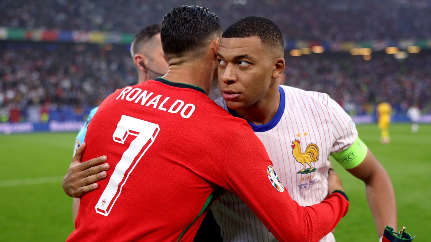 Kylian Mbappé and Cristiano Ronaldo embrace ahead of France vs. Portugal at Euro 2024.