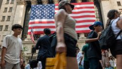 People walk by the New York Stock Exchange New York on July 05, 2024.