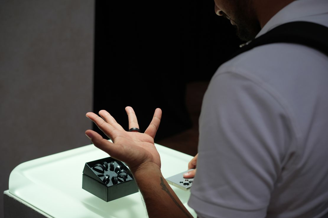 An attendee tries on a Galaxy Ring wearable smart device at the Samsung Electronics Co. Unpacked launch in Paris.