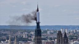 Smoke billows from the spire of Rouen Cathedral in Rouen, northern France on Thursday.