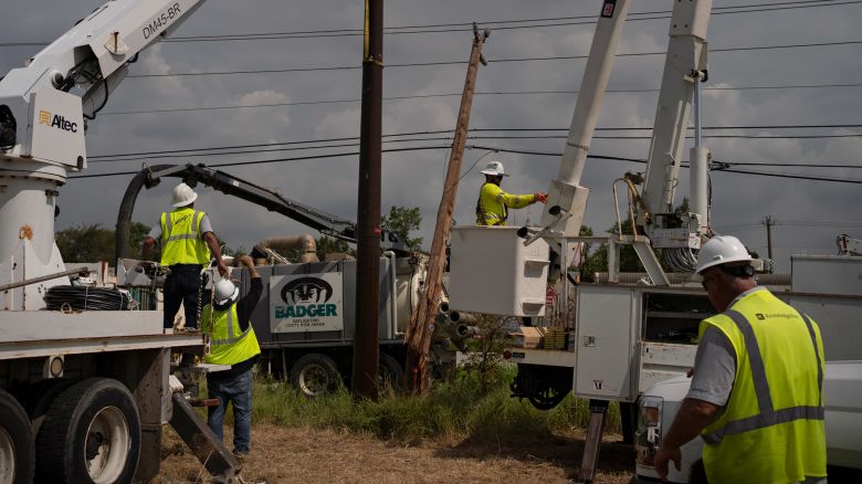 CenterPoint foreign assistance crews work to restore power lines on July 11, 2024 in Houston, Texas. Nearly one million people still remain without electricity in the wake of Hurricane Beryl, which was a category one hurricane that made a direct hit on Houston and surrounding areas on July 8, leaving more than two million people without power.