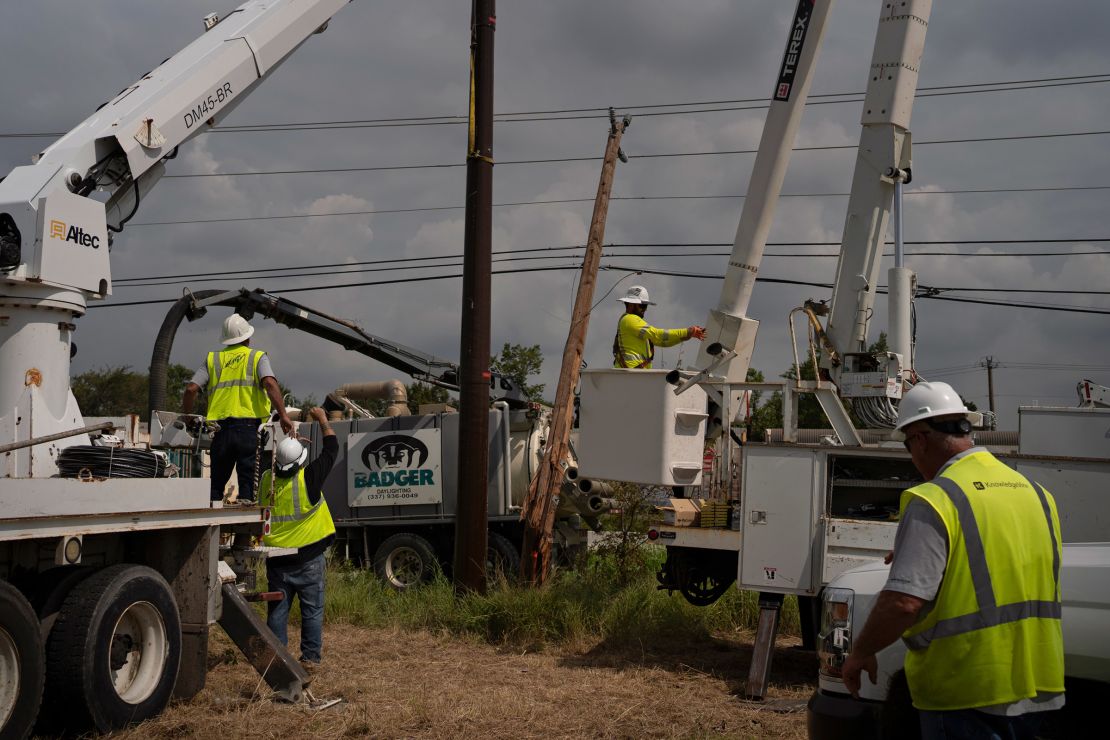 CenterPoint foreign assistance crews work to restore power lines on July 11 in Houston.