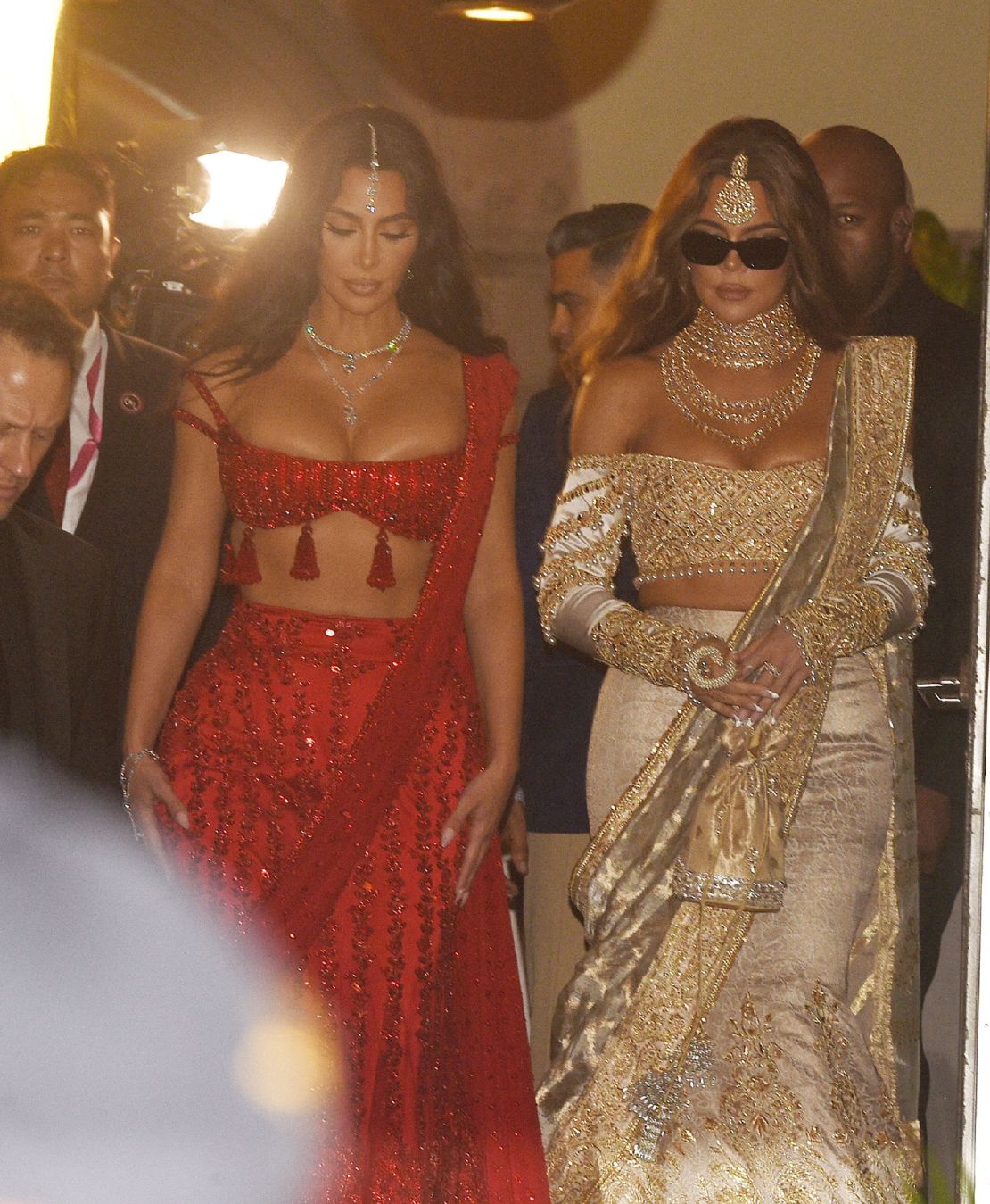 Kim and Khloé Kardashian are seen arriving at the Ambani wedding on Friday.