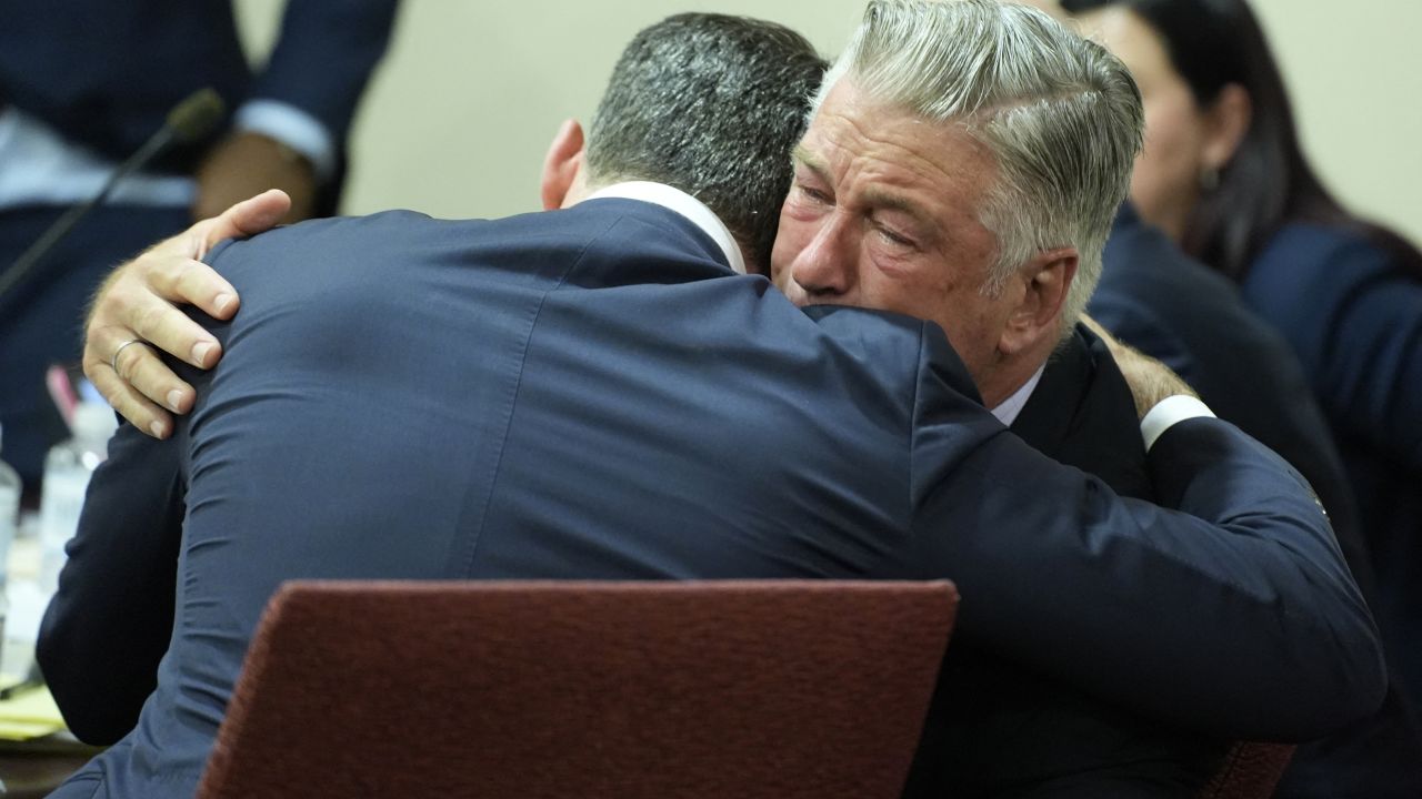 US actor Alec Baldwin hugs his attorney Alex Spiro at the conclusion of his trial on involuntary manslaughter at Santa Fe County District Court in Santa Fe, New Mexico, on July 12, 2024. Baldwin's trial for involuntary manslaughter was dismissed by a judge Friday after she ruled that key evidence over a fatal shooting on the set of "Rust" had been withheld from the defense. (Photo by RAMSAY DE GIVE / POOL / AFP) (Photo by RAMSAY DE GIVE/POOL/AFP via Getty Images)