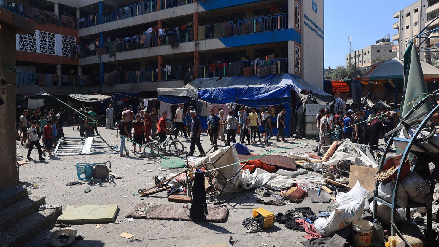 Palestinians survey the damage following the Israeli military bombardment of UNRWA's Abu Oraiban school on July 14, 2024.