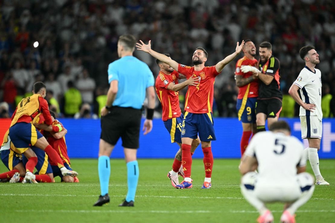 Spain players celebrate after defeating England and winning Euro 2024.