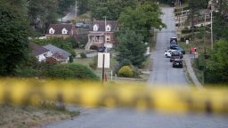 Police continue to block roads around the home of Thomas Matthew Crooks as the FBI continues its investigation into the attempted assassination of former US President Donald Trump in Bethel Park, Pennsylvania, on July 14, 2024. Trump, the presumptive Republican presidential candidate, was shot in the ear July 13 in the opening minutes of his campaign rally in Butler. Rivals Joe Biden and Donald Trump urged Americans to show unity on July 14, after an assassination attempt on the Republican that the FBI said was carried out by a shooter with a legally-bought semi-automatic rifle. (Photo by Rebecca DROKE / AFP) (Photo by REBECCA DROKE/AFP via Getty Images)