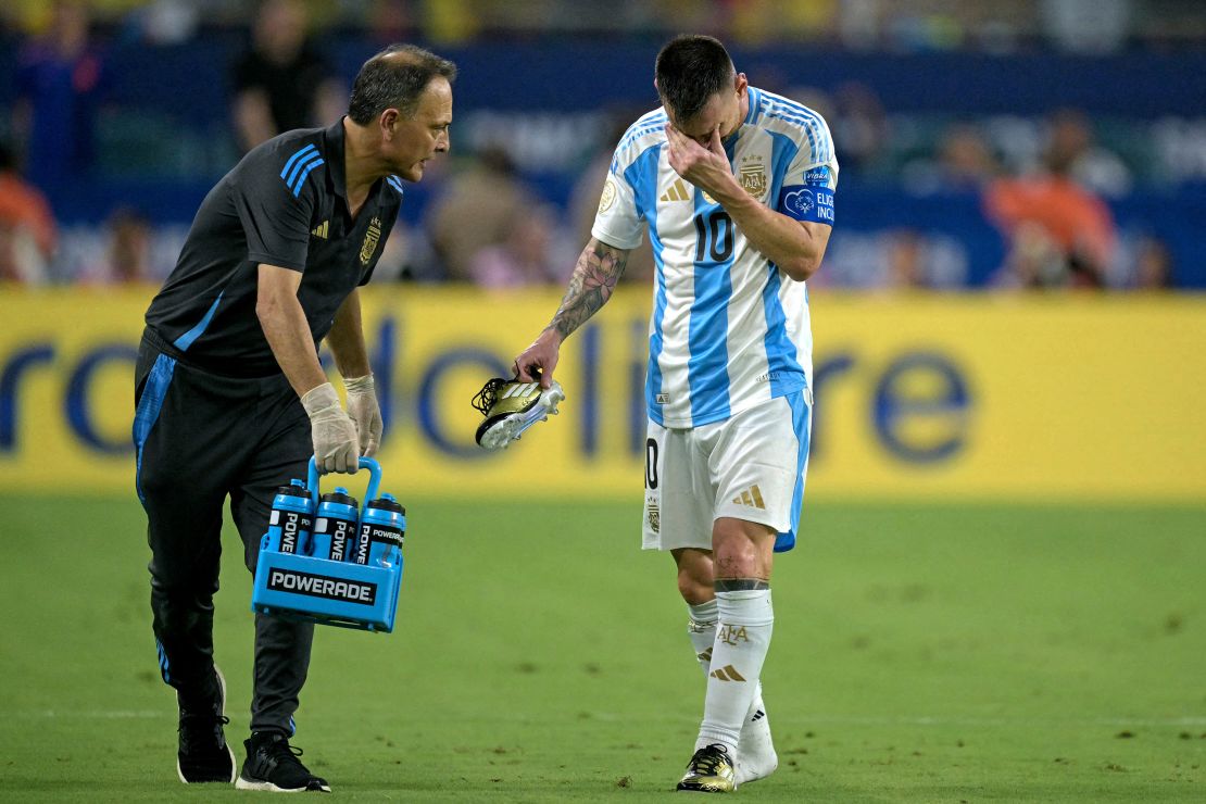 Argentine captain Lionel Messi leaves the pitch in tears after an apparent ankle injury during the Copa America final football match against Colombia on July 14, 2024. 
