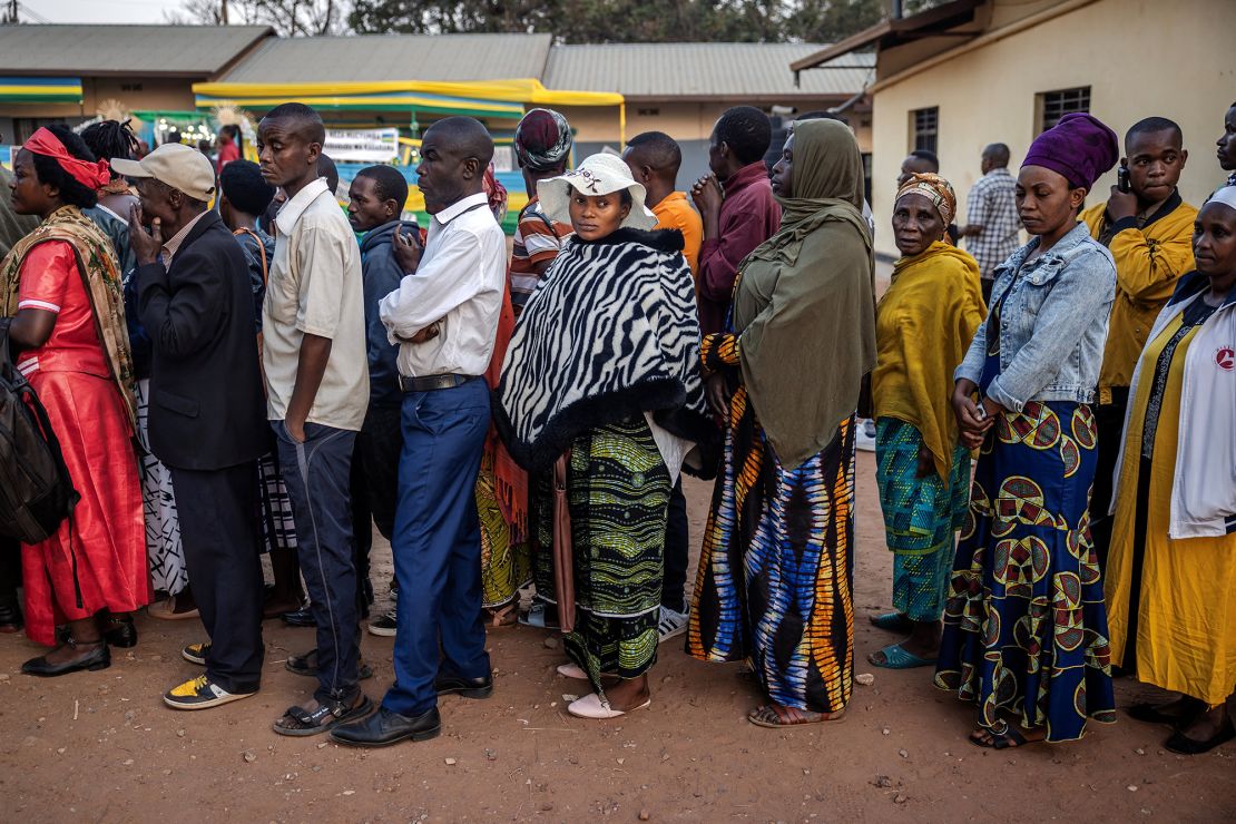 Voters queue to cast their ballot early in the morning before the opening of the polls during the 2024 Rwandan general elections at a polling station in Kigali on Monday.