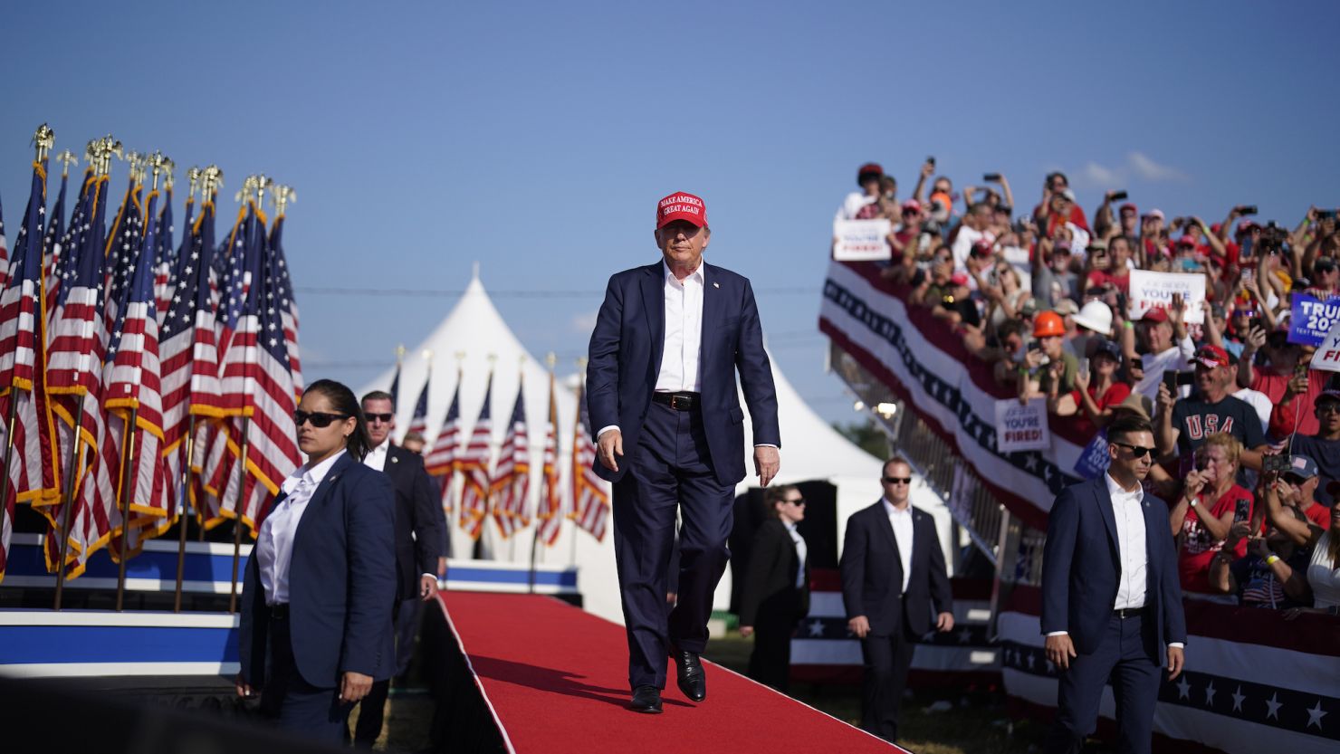 Former President Donald Trump walks onstage during a campaign rally in Butler, Pennsylvania, on Saturday, minutes before a gunman opened fire from a nearby rooftop.