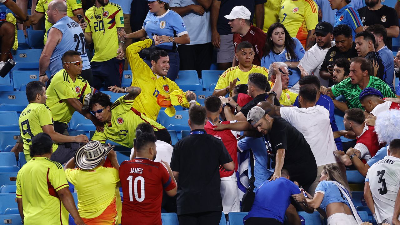 CHARLOTTE, NORTH CAROLINA - JULY 10: Fans of Colombia fight with fans of Uruguay during the CONMEBOL Copa America 2024 semifinal match between Uruguay and Colombia at Bank of America Stadium on July 10, 2024 in Charlotte, North Carolina. (Photo by Tim Nwachukwu/Getty Images)