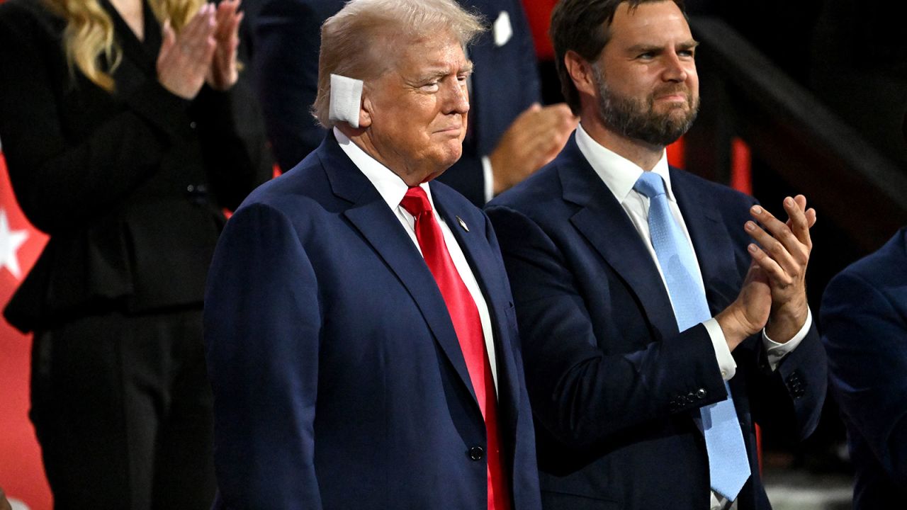 Former US President Donald Trump, left, and Senator JD Vance, a Republican from Ohio and Republican vice-presidential nominee, during the Republican National Convention (RNC) at the Fiserv Forum in Milwaukee, Wisconsin, US, on Monday, July 15, 2024. Former President Donald Trump tapped JD Vance as his running mate, elevating to the Republican presidential ticket a venture capitalist-turned-senator whose embrace of populist politics garnered national attention and made him a rising star in the party. Photographer: David Paul Morris/Bloomberg via Getty Images