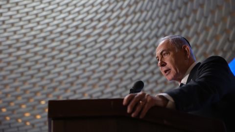 Israeli Prime Minister Benjamin Netanyahu speaks during a commemoration ceremony for soldiers killed during the 2014 Gaza war, also known as Operation Protective Edge, at the Memorial Hall on Mount Herzl in Jerusalem on July 16, 2024.