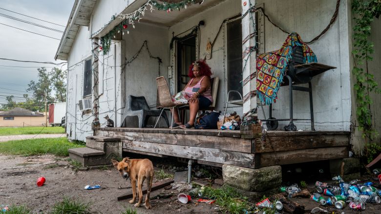 HOUSTON, TEXAS - JULY 11: Menifee Lucy, 60, sits on her front porch for air in the Kashmere Gardens neighborhood on July 11, 2024 in Houston, Texas. Lucy's home lost power as Hurricane Beryl passed through Texas on July 8th. "I've lost all my foods but these noodles; all of my meat spoiled. No power for 4 days now, I don't know what to do... I can't cook, all I have are these noodles. Young man, I can't cook and I'm hungry," said Lucy. Millions of residents around the Houston metropolitan and costal areas continue braving the aftermath of Hurricane Beryl's destruction. Weather reports are indicating a stall in recovery efforts as chances of storms increase throughout the region. (Photo by Brandon Bell/Getty Images)