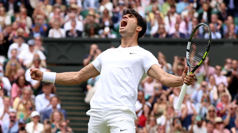 Carlos Alcaraz of Spain celebrates winning match point against Daniil Medvedev in the Men's Singles Semi-Final match during day twelve of The Championships Wimbledon 2024 at All England Lawn Tennis and Croquet Club on July 12, 2024 in London, England.