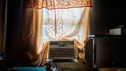 Larry Nelson's unpowered AC unit sits in the window sill of his home in the Third Ward neighborhood on July 12, 2024 in Houston, Texas. Nelson, 71, had not had access to his oxygen tank because of power outages.