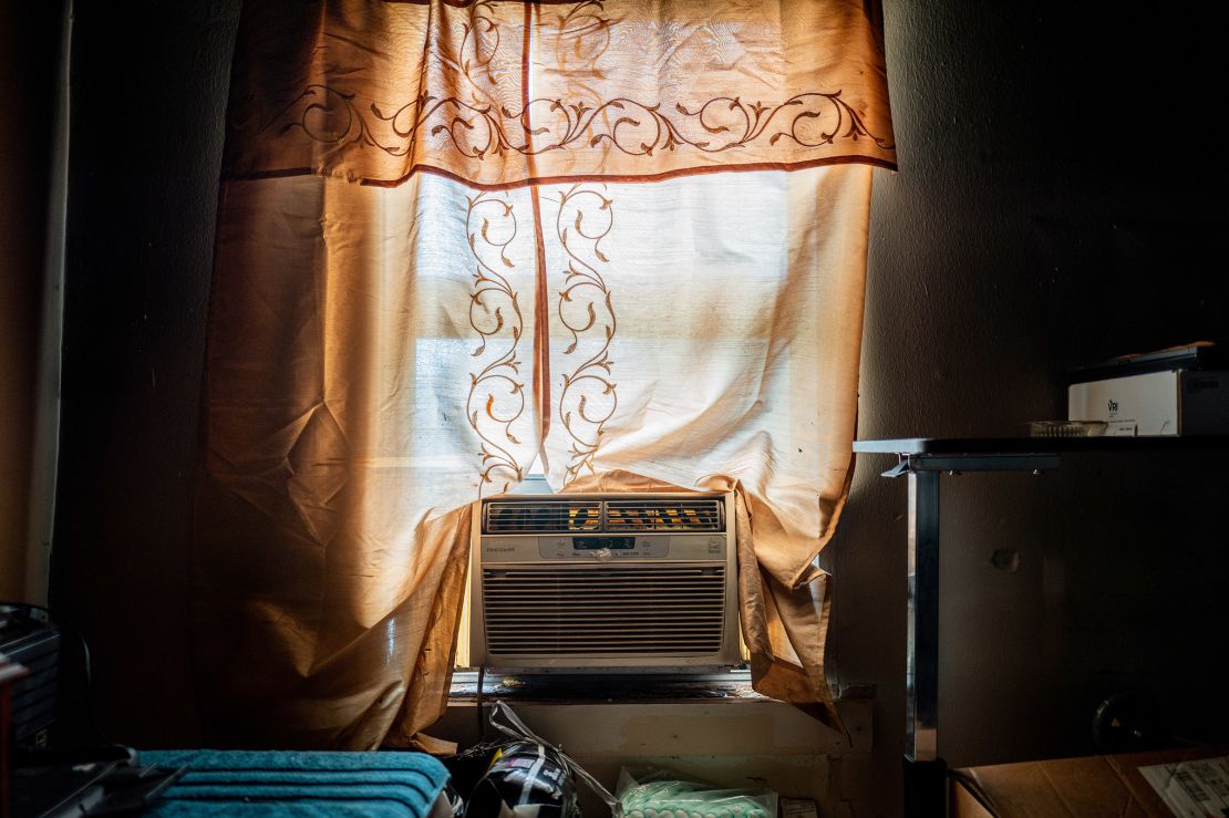 Larry Nelson's unpowered AC unit sits in the window seal of his home in the Third Ward neighborhood on Friday in Houston, Texas.