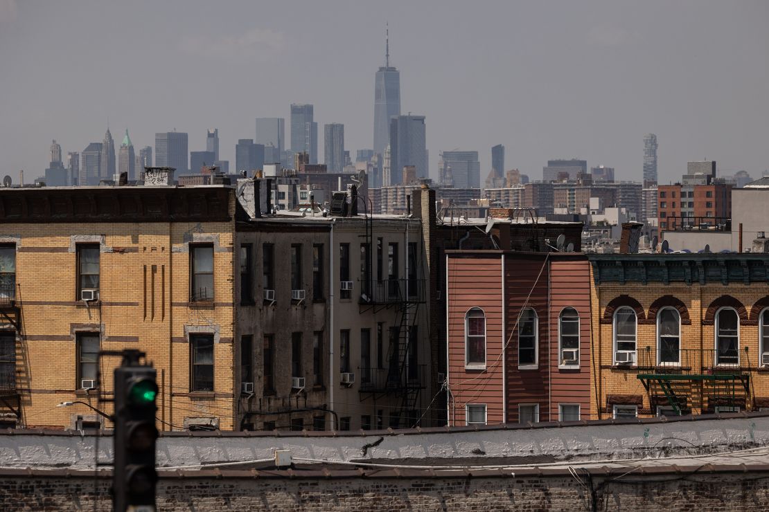 Residential apartment buildings in front of the Manhattan skyline in the Queens borough of New York, US, on Tuesday, July 16, 2024.