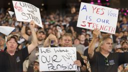 People hold signs for a "yes" vote as members and supporters of the International Association of Machinists attend an early strike-sanction vote event at T-Mobile Park in Seattle, Washington on July 17, <strong><em>YEAR MISSINGT</em></strong>he union is set to strike Boeing for the first time in 16 years on September 13 without a deal on a new contract.