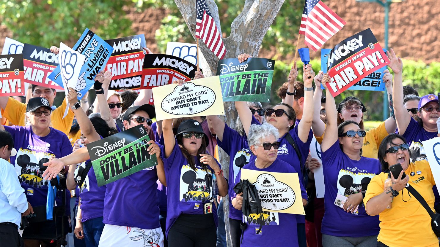 Disney employees rally outside the main entrance of Disneyland Resort in Anaheim, California, on July 17, 2024, ahead of the strike authorization vote prior to a tentative deal being struck on Tuesday.