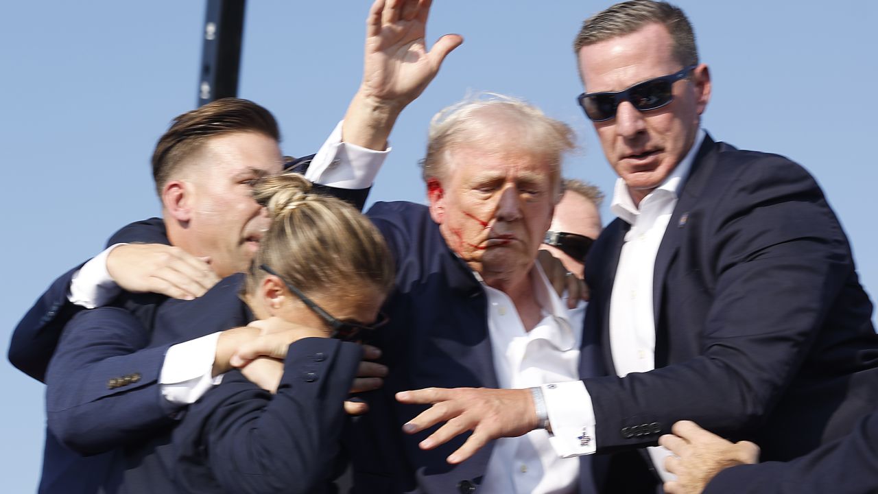 BUTLER, PENNSYLVANIA - JULY 13: Republican presidential candidate former President Donald Trump is rushed offstage during a rally on July 13, 2024 in Butler, Pennsylvania. (Photo by Anna Moneymaker/Getty Images)