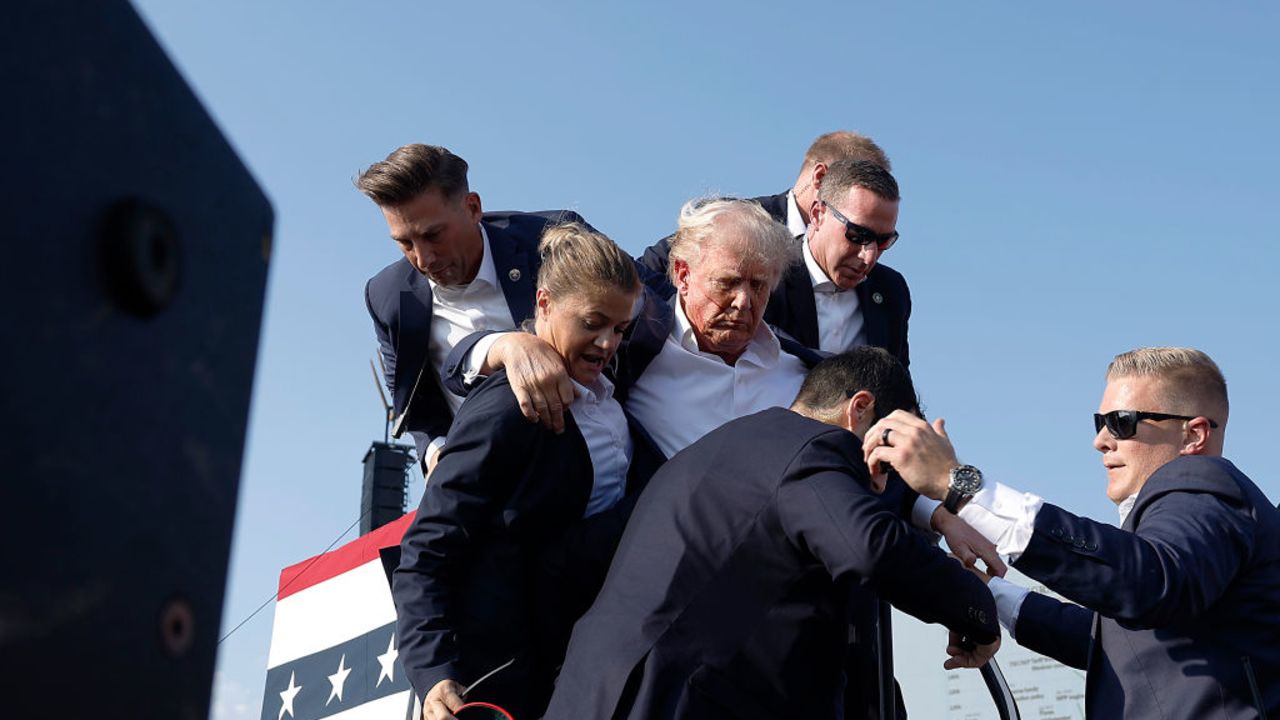 BUTLER, PENNSYLVANIA - JULY 13: Republican presidential candidate former President Donald Trump pumps his fist as he is rushed offstage during a rally on July 13, 2024 in Butler, Pennsylvania. Butler County district attorney Richard Goldinger said the shooter is dead after injuring former U.S. President Donald Trump, killing one audience member and injuring another in the shooting. (Photo by Anna Moneymaker/Getty Images)