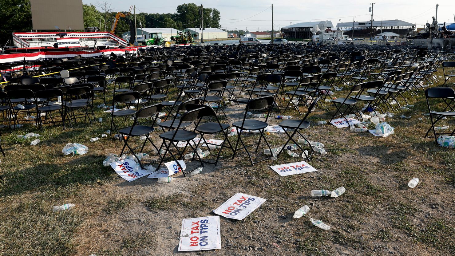 Campaign signs and empty water bottles are seen on the ground of former President Donald Trump's rally on July 13, 2024, in Butler, Pennsylvania.