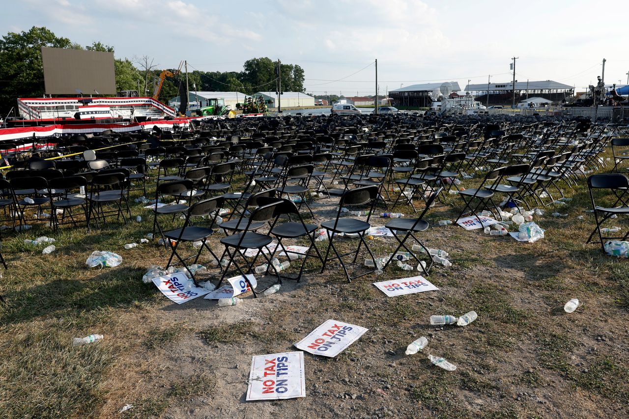 Campaign signs and empty water bottles are seen on the ground of a campaign rally for Republican presidential candidate former President Donald Trump on July 13 in Butler, Pennsylvania.