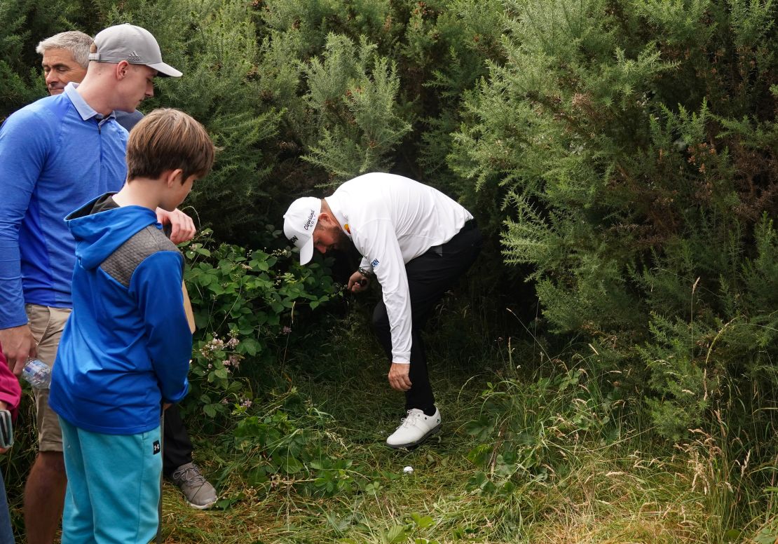 Ireland's Shane Lowry searches for his ball in the heavy rough on the 11th during day two of The Open at Royal Troon, South Ayrshire, Scotland. Picture date: Friday July 19, 2024. (Photo by Owen Humphreys/PA Images via Getty Images)