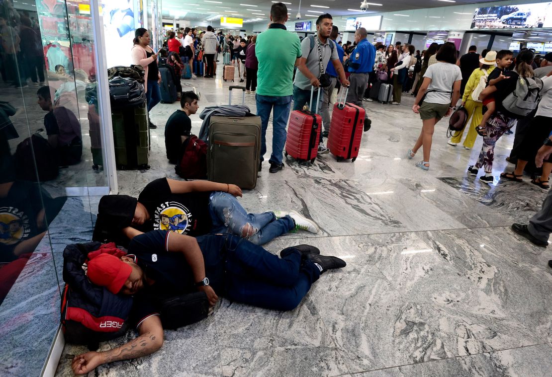 Passengers take a nap on the floor as they wait for their flights at the Guadalajara International Airport in Mexico on July 14, 2024. Sometimes, if might be easier to hunker down at the airport rather than scramble for a hotel room during a flight delay.