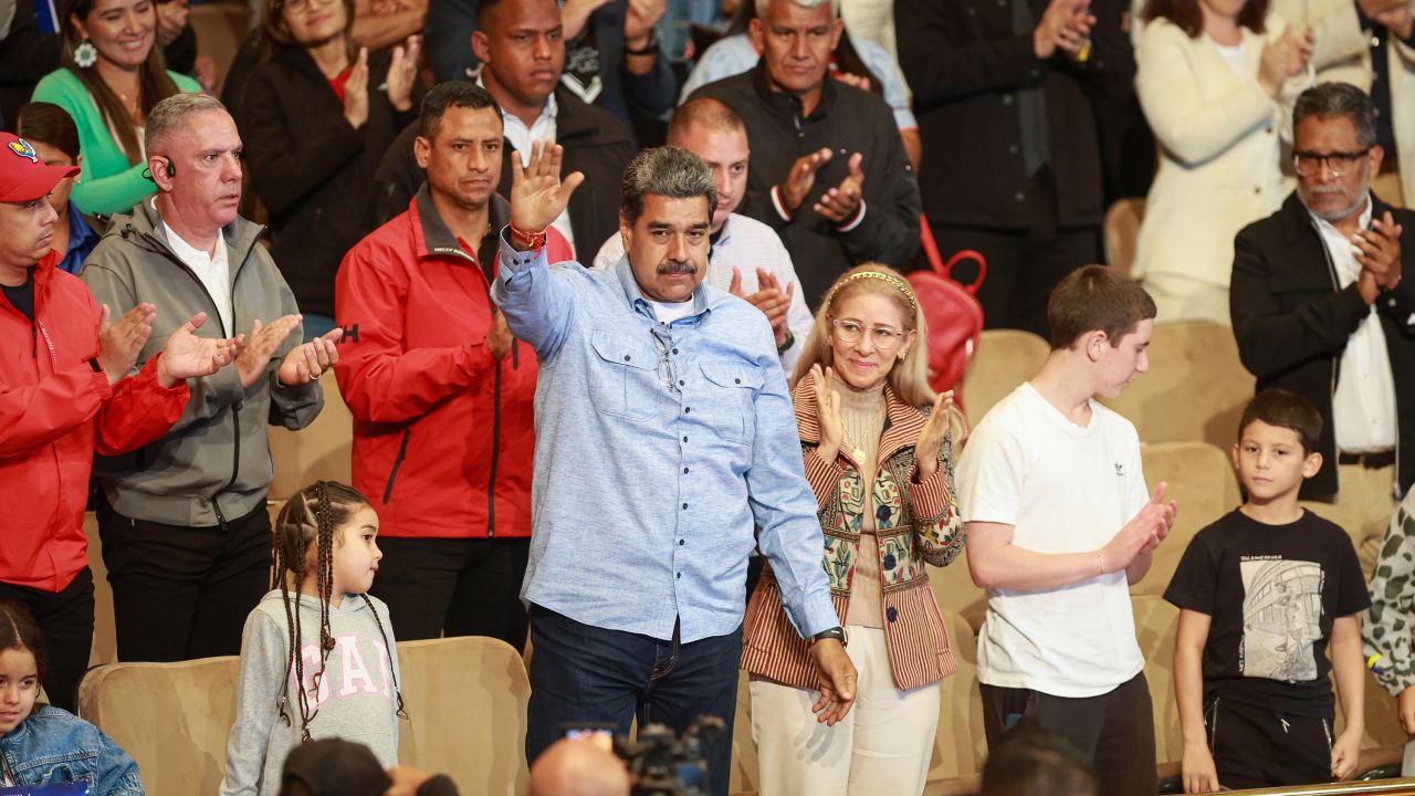 CARACAS, VENEZUELA - JULY 14: Venezuelan President Nicolas Maduro with his wife and primera combatiente Cilia Flores greets the audience during the presentation of a biographical film and a book about Maduro at the Teresa Carreño Theater on July 14, 2024 in Caracas, Venezuela. (Photo by Jesus Vargas/Getty Images)