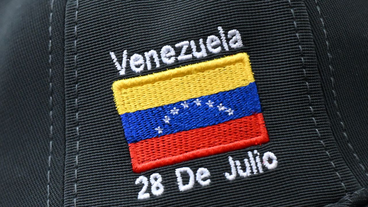 View of a cap bearing an election-related embroidery during the operation check of the electoral machines which will be used in the next presidential election, in Caracas on July 21, 2024. Venezuela will hold general election next July 28 (Photo by Raul ARBOLEDA / AFP) (Photo by RAUL ARBOLEDA/AFP via Getty Images)