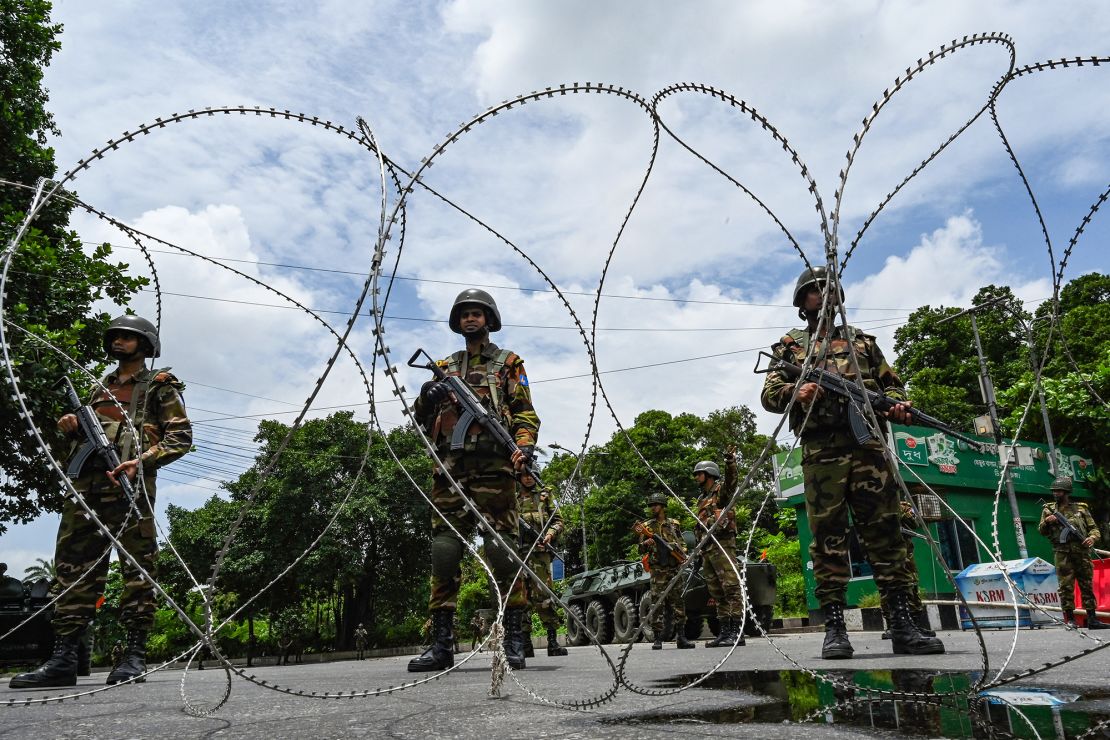 Bangladesh army staff near the Parliament's house in the middle of a curfew after clashes between the police and the protesters, in Dhaka on July 22, 2024.