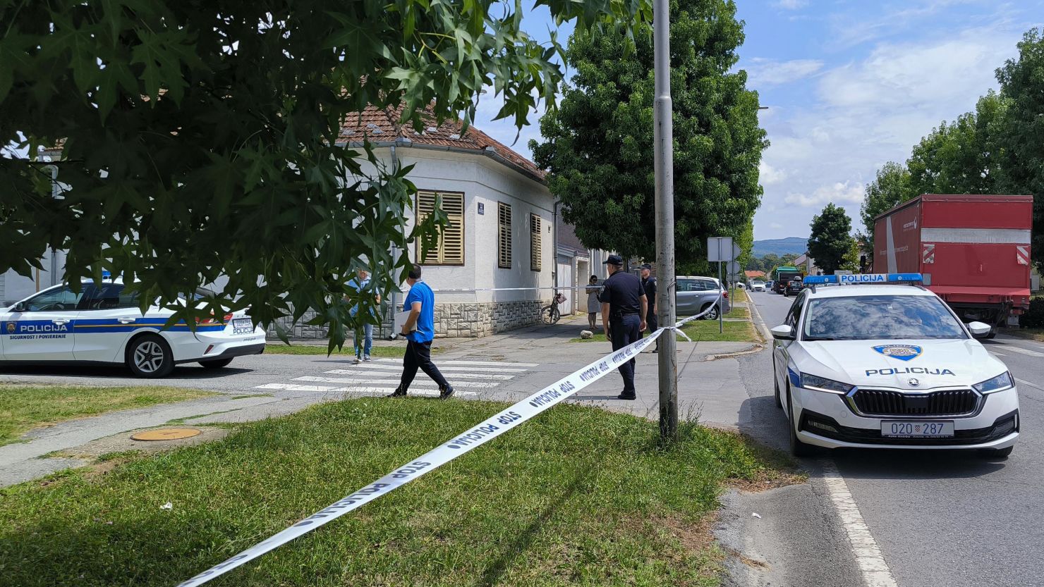 Police cars are stationed in front of a retirement home where at least five people were killed in a shooting in Daruvar, Croatia on July 22, 2024.