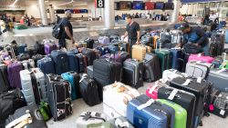 Delta passengers try to find their bags after cancelled and delayed flights at Hartsfield-Jackson Atlanta International Airport on July 22, 2024 in Atlanta, Georgia. Delta Airlines cancelled over 700 flights on Monday due to the Crowdstrike software update, making up more than half of the flight cancellations in the U.S.